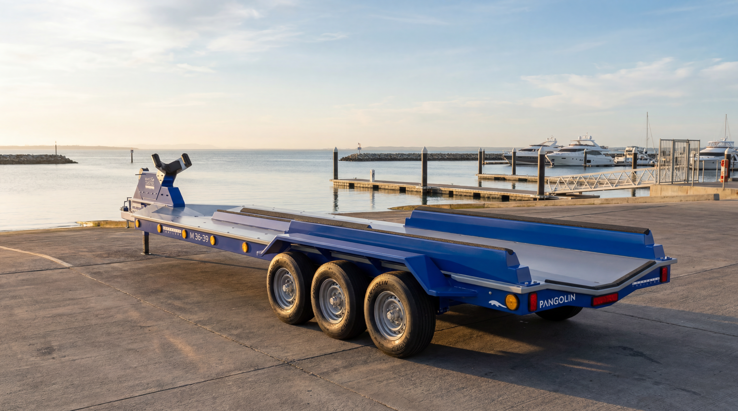 Pangolin Marine M36-39 composite boat trailer at a yacht club launch area