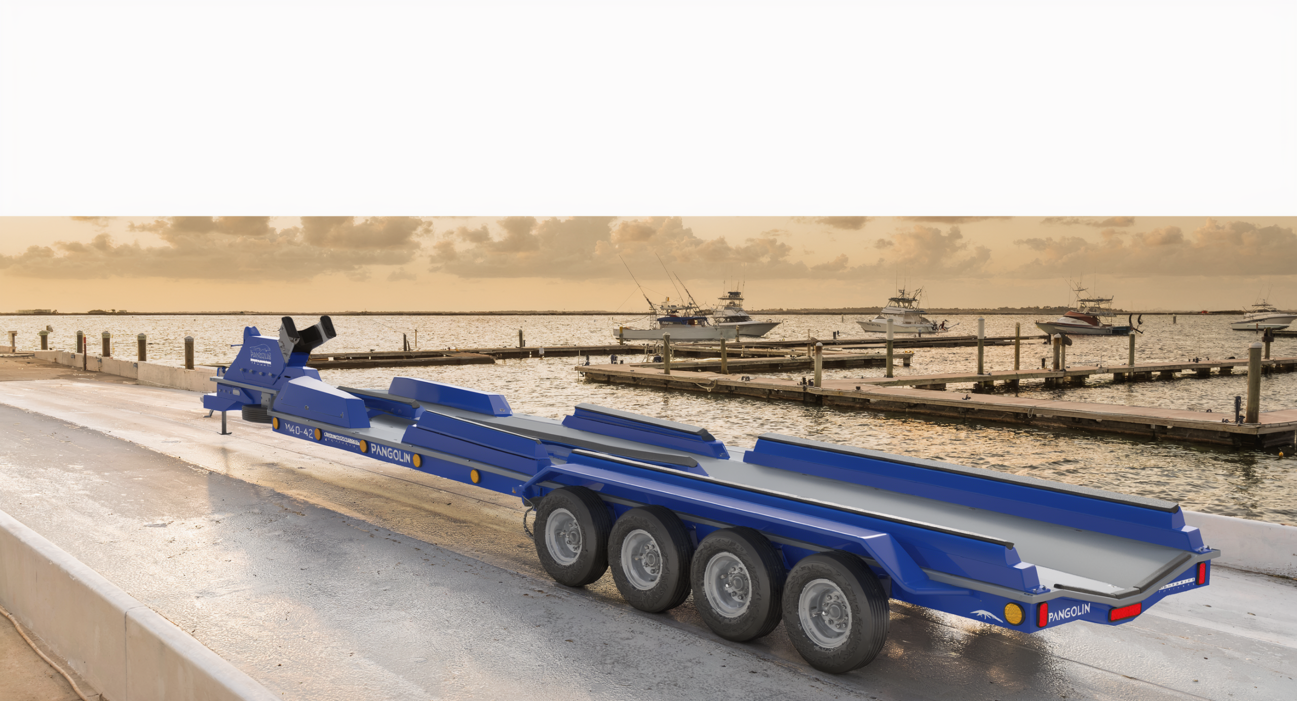 Pangolin Marine M40-42 composite boat trailer at an offshore marina launch ramp