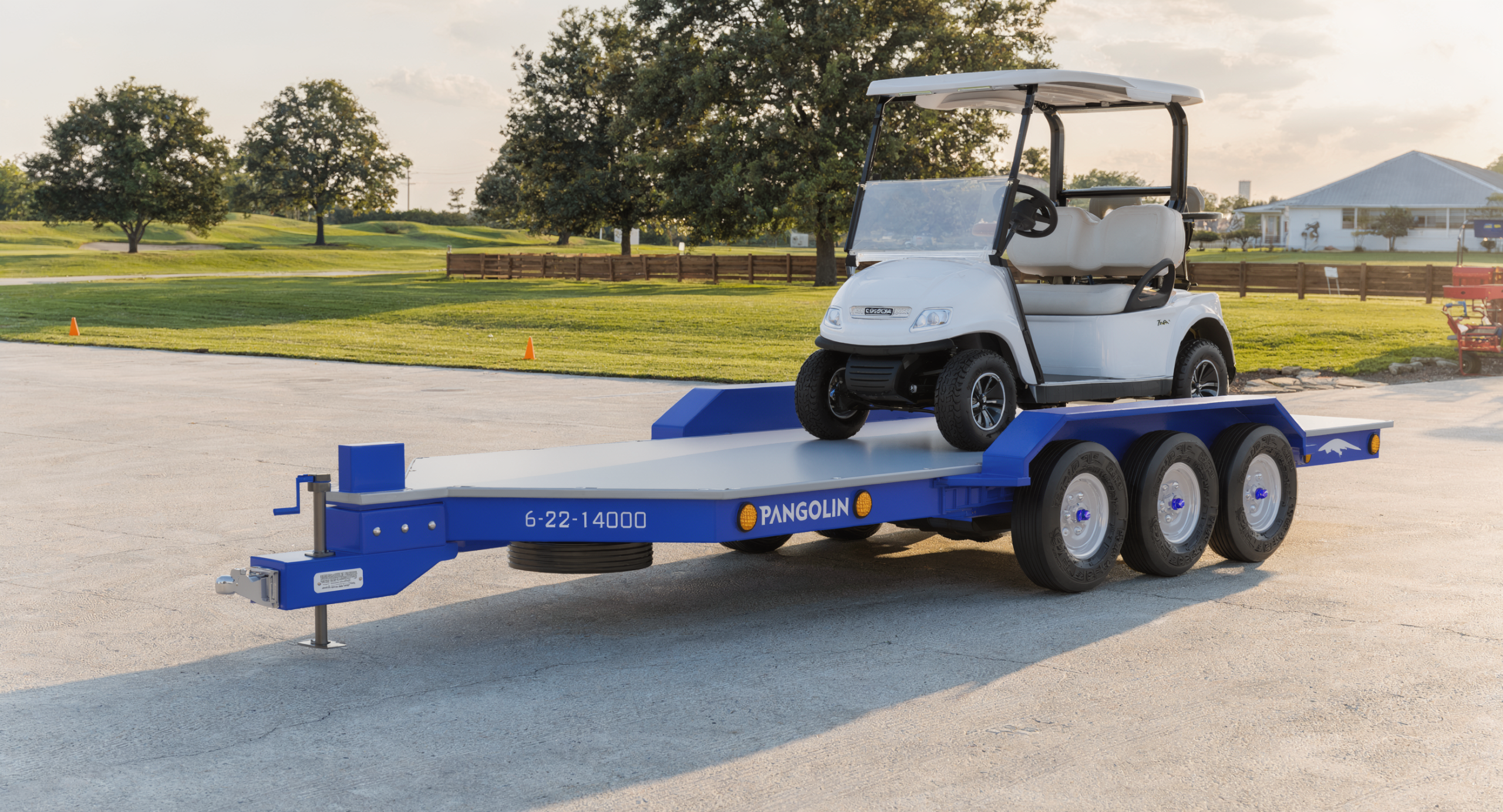 Pangolin Terra 22 composite utility trailer carrying a utility cart on a rural property