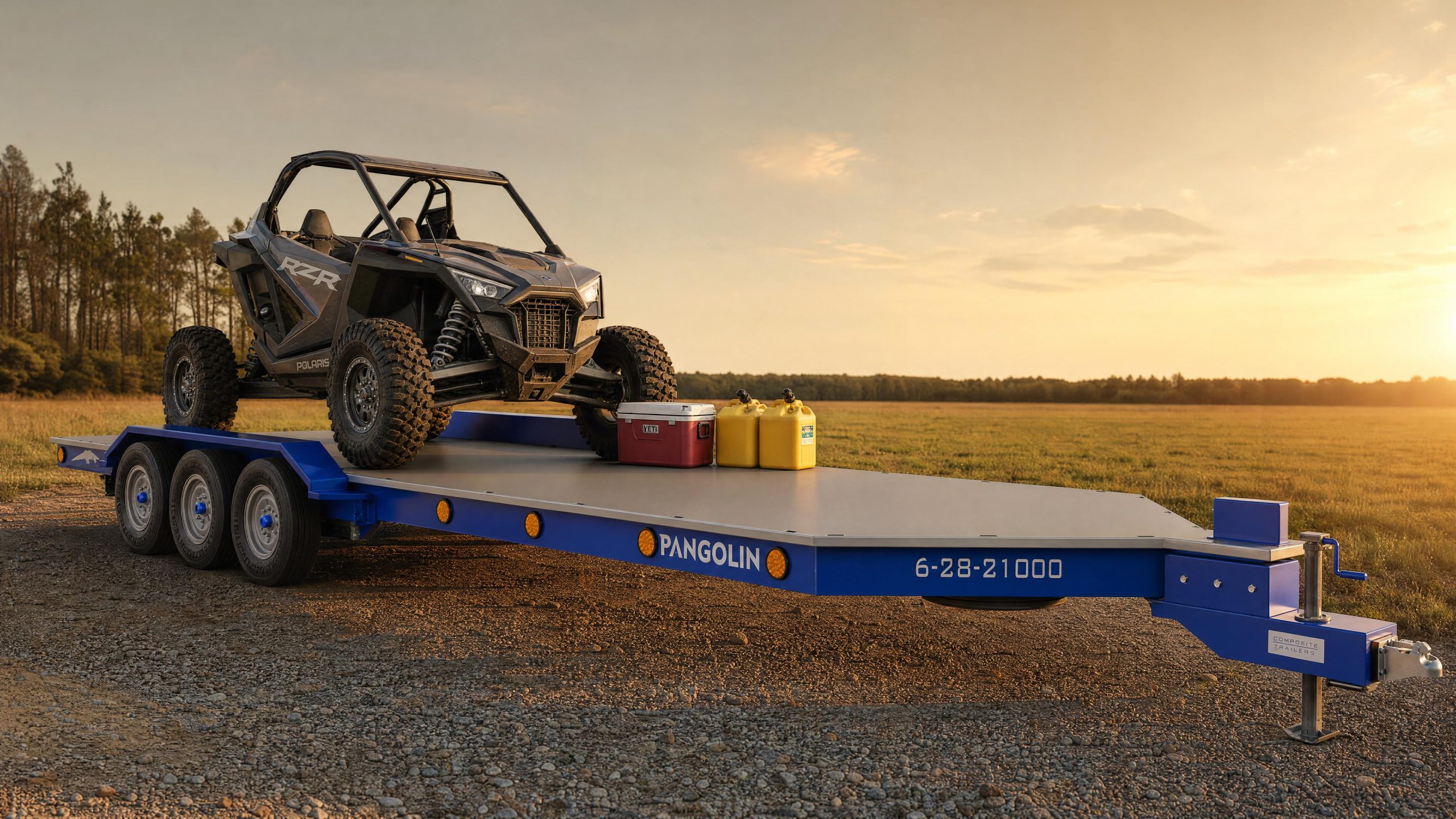Pangolin Terra 28 composite utility trailer loaded with a large UTV and outdoor gear